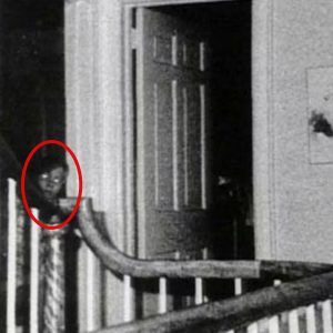 Amityville Ghost - 1976: This photo, taken by Ed and Lorraine Warren, claims to show the ghost of 9-year-old John DeFeo.